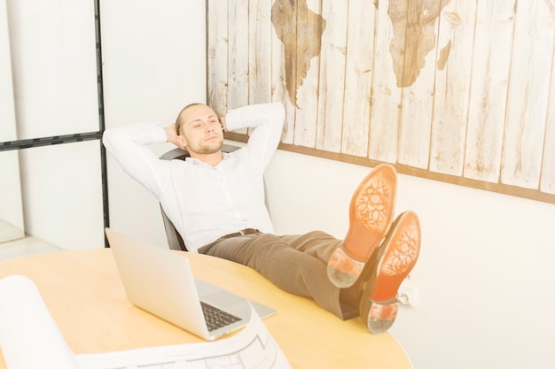businessman-relaxing-office_23-2148017054